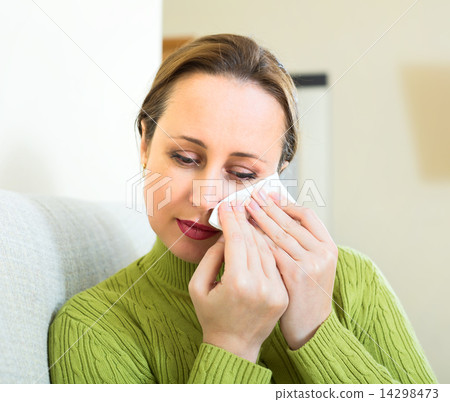 Woman wiping tears 14298473