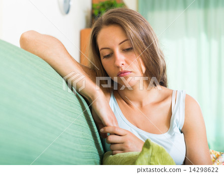 Sad woman on sofa Sad woman on sofa 14298622
