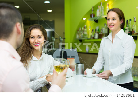 Couple with wine at bar Couple with wine at bar 14298691