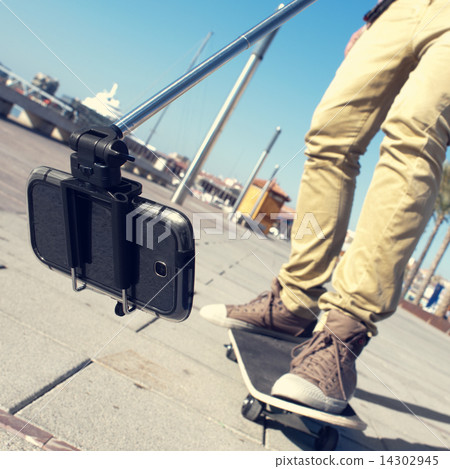 skater taking a selfie skater taking a selfie 14302945