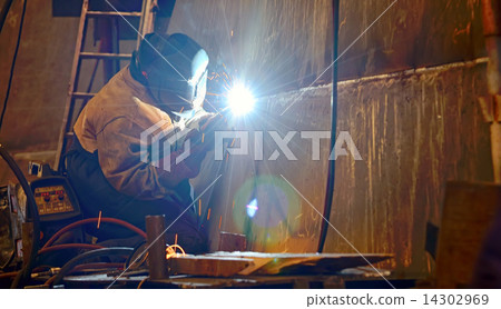 a welder working at shipyard 14302969