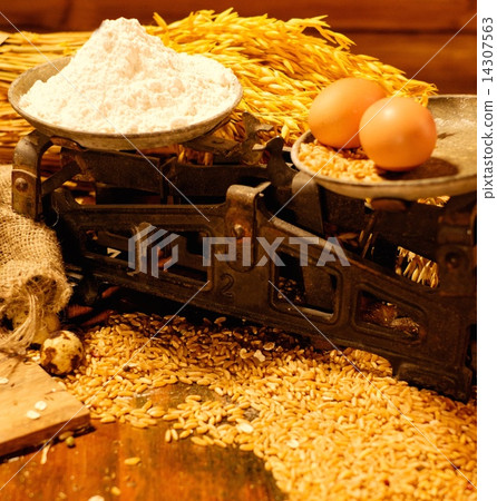 Scales among homemade baked goods on a table Scales among homemade baked goods on a table 14307563