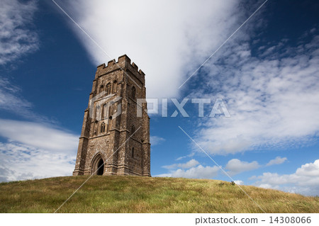 Tourists exploring the ruins of St. Michael's Tower at the top of glastonbury tor Tourists exploring the ruins of St. Michael's Tower at the top of glastonbury tor 14308066