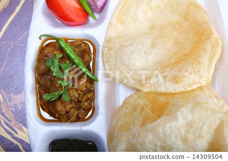 indian spicy dish, chole bhature topping of green chili 14309504