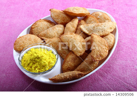 gujia in plate with holi color in bowl gujia in plate with holi color in bowl 14309506