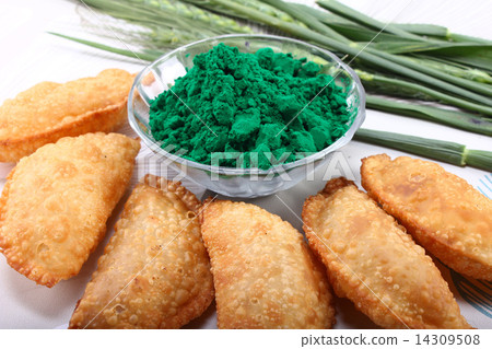 gujia with holi green color on white background along with green 14309508
