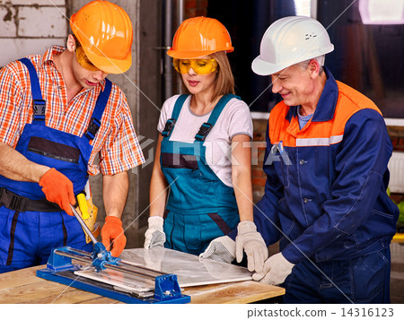 Group people builder cutting ceramic tile. Group people builder cutting ceramic tile. 14316123
