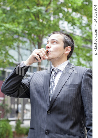 Foreign businessman drinking energy drink 14318974