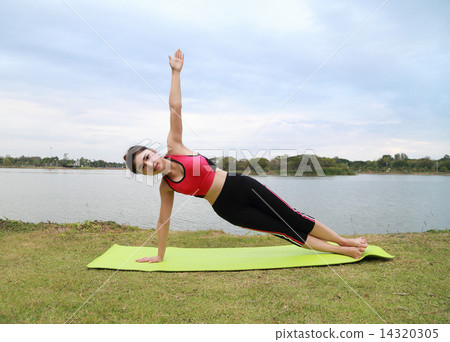 Young woman doing yoga exercise Young woman doing yoga exercise 14320305