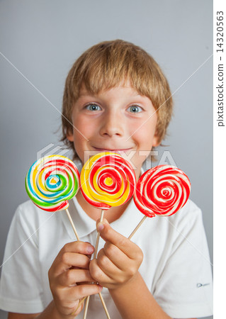child boy eating lollipop child boy eating lollipop 14320563