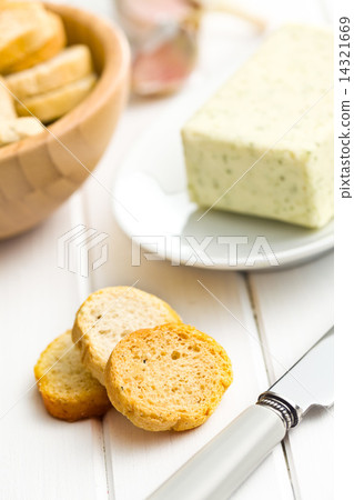 sliced  bruschetta on white wooden table 14321669