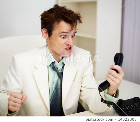 Very angry businessman in office Very angry businessman in office 14322305