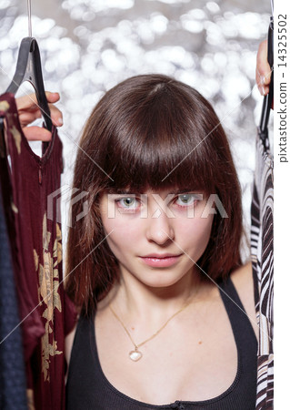 beautiful teenage girl and her wardrobe, with bokeh 14325502