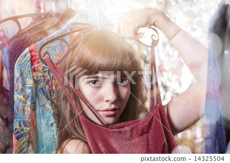 beautiful teenage girl try a dress, with bokeh, backlit and ligh 14325504
