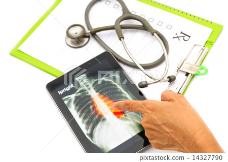 Doctor looking chest  x-ray image on tablet for medical exam 14327790