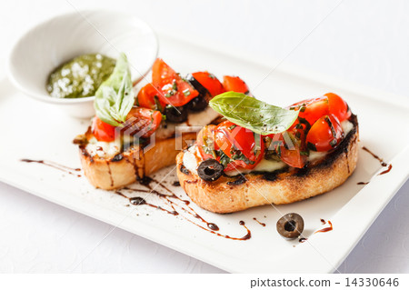 Bruschetta with tomato, mozarella and basil Bruschetta with tomato, mozarella and basil 14330646