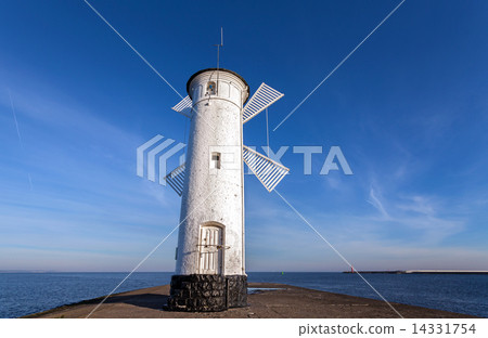 Old windmill lighthouse in Swinoujscie, Poland. Old windmill lighthouse in Swinoujscie, Poland. 14331754