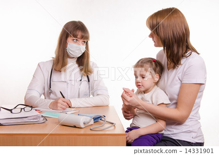 Pediatrician talking in office with a young mother with child on her lap Pediatrician talking in office with a young mother with child on her lap 14331901
