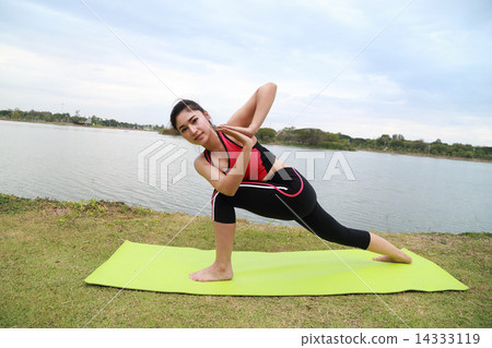 Young woman doing yoga exercise 14333119