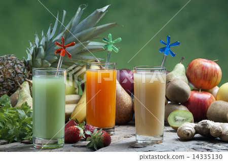 juices of mixed fruit on a wooden board 14335130
