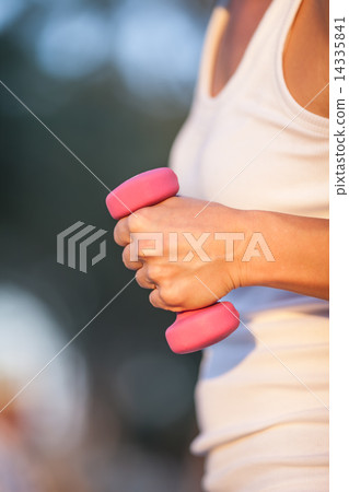with dumbbells in hand 14335841