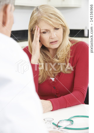 Worried Mature Woman Meeting With Doctor In Surgery 14336966