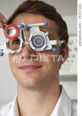 Man Having Sight Test At Optometrist Man Having Sight Test At Optometrist 14337181