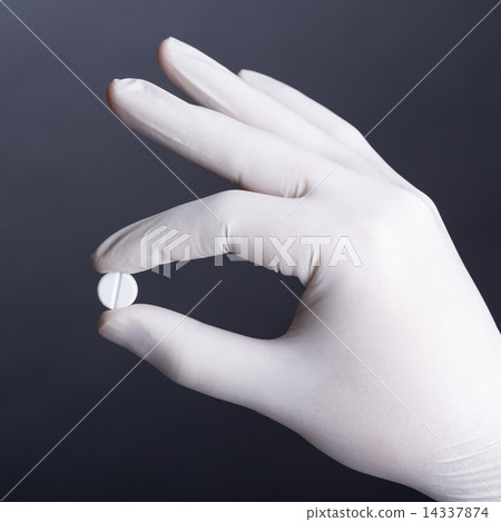 Hand with pill 14337874