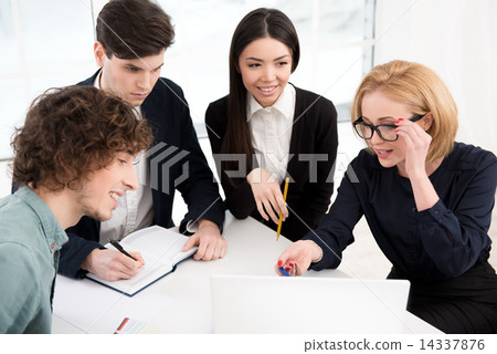 Business team working and discussing project in office 14337876