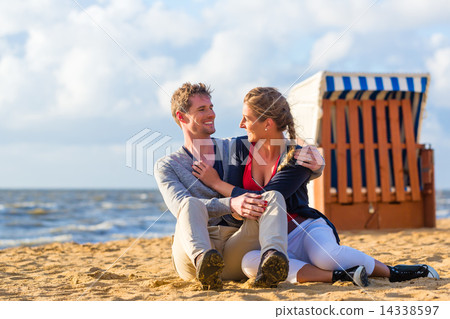 Couple in romantic sunset on beach 14338597