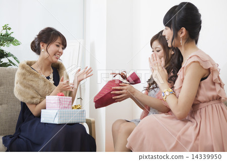 A woman giving a gift A woman giving a gift 14339950