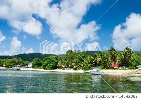 Seychelles, motor boat against the tropical backdrop of the rock Seychelles, motor boat against the tropical backdrop of the rock 14342062