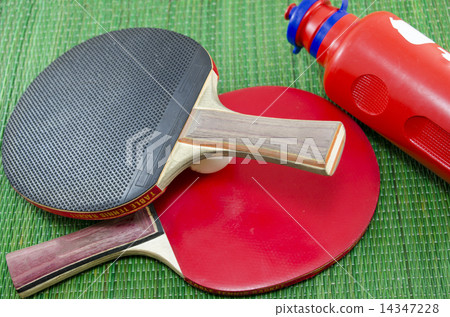 Two vintage table tennis rackets and a water bottle 14347228