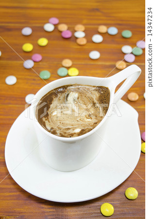 Cup of coffee and bombons of various colors Cup of coffee and bombons of various colors 14347234