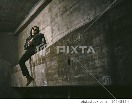 Young man and concrete wall 14348554