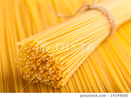 neatly lined with raw spaghetti 14349680