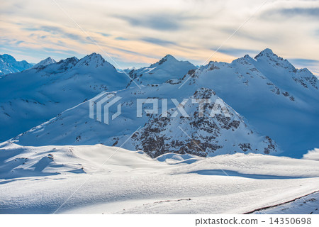 Snowy blue mountains in clouds 14350698
