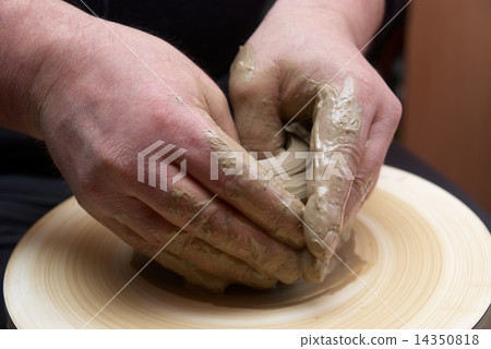 Hands forming clay pot 14350818