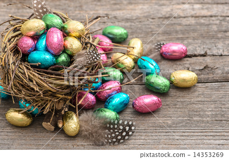 Chocolate easter eggs in nest. Festive still life Chocolate easter eggs in nest. Festive still life 14353269