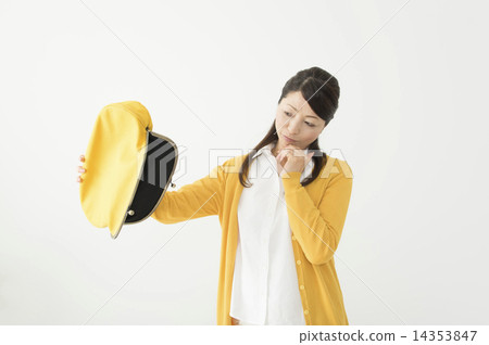 Disappointed middle lady looking at empty purse 14353847