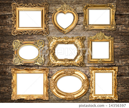 Baroque style golden frames over wooden background. Antique obje 14356397
