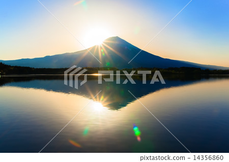 Upside down reflected in Tanuki Lake and the glow of the sun 14356860