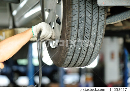 Checking /add air pressure . pumping air into auto wheel. vehicle safe concept.  14358457