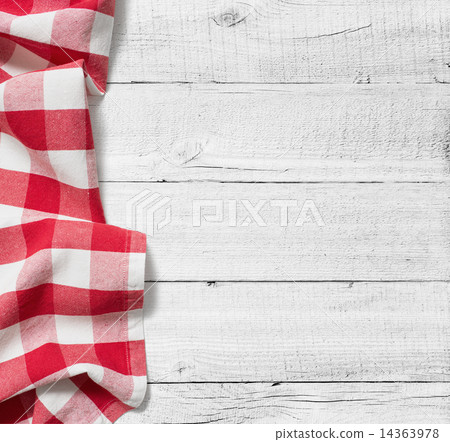 red folded tablecloth over white wooden table 14363978