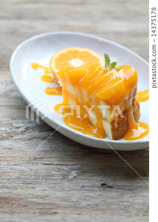 Orange cake on wood background 14375178