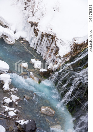 Blue river and winter waterfall 14376321