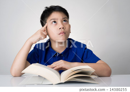 Little asian boy read a book and think about that Little asian boy read a book and think about that 14380255