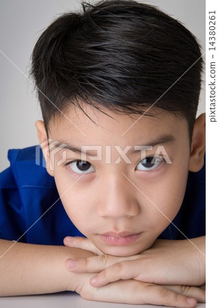 portrait of asian cute boy sad and  looking very disappointed 14380261