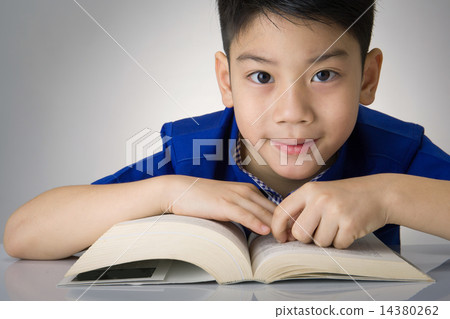 Little asian boy read a book Little asian boy read a book 14380262