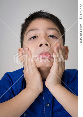 portrait of asian cute boy sad and  looking very disappointed 14380278